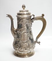 A George II silver baluster coffee pot, with later embossed decoration, make ?W, London, 1751,