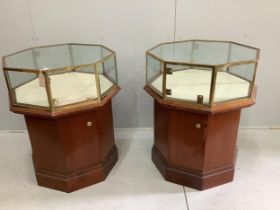 A pair of octagonal brass mounted display cases, width 69cm, height 90cm