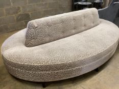 A Bray Design conversation sofa with brass trim, upholstered in Zimmer & Rohde vermicelli velvet,