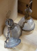 A cream lamp in the style of Christian Dell and a pair of glass and brass hanging lights