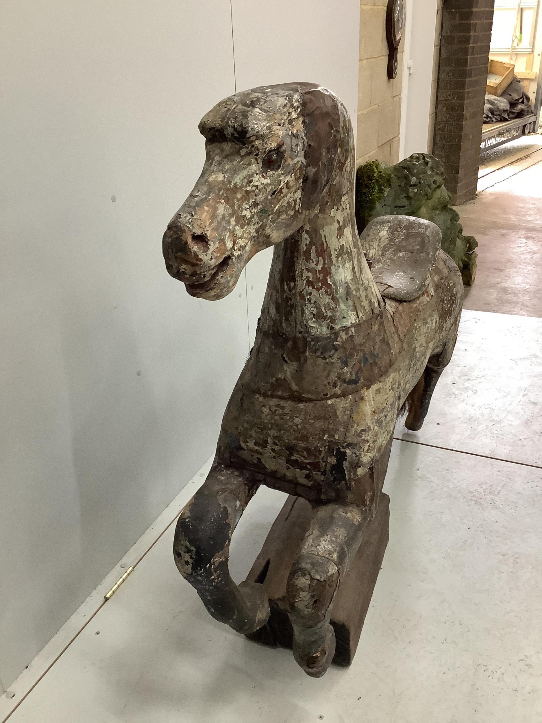 A vintage metal bound carved wood carousel fairground horse with traces of original paint, length - Image 2 of 3