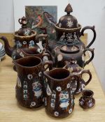 Measham Barge ware glazed pottery including teapots and jugs, decorated in relief, largest 28cm