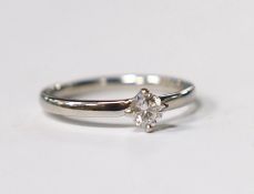 A platinum and solitaire diamond set ring, size O, gross weight 3.5 grams, the stone diameter