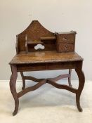 An early 20th century Liberty retailed Japanese carved wood desk, width 94cm, depth 63cm, height