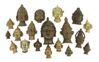 A group of nineteen bronze or brass Shiva masks, Southern India, 16th-19th century, 6.2 - 19.5cm