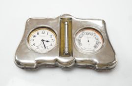 An Edwardian silver mounted leather clock/barometer desk stand, containing a pocket watch,