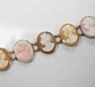 A yellow metal mounted ten stone oval cameo shell set bracelet, each carved with bust of a lady to