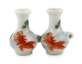 A pair of Chinese enamelled porcelain ‘goldfish’ bird feeders, Guangxu period, each painted with a