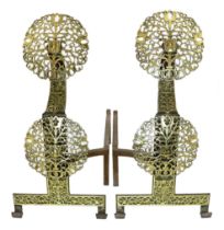 A pair of Arts & Crafts cast iron and pierced brass firedogs, in the manner of Edward Spencer and