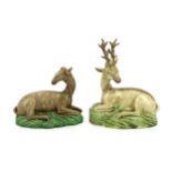 A near pair of Ralph Wood type figures of a Stag and Hind, c.1790, each modelled recumbent upon a