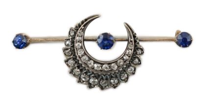 A Victorian gold and silver, three stone sapphire and diamond cluster set double crescent bar