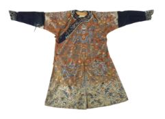 A Chinese chestnut-ground ‘nine dragon’ robe, jifu, 19th century, finely embroidered with nine