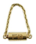 A mid to late 20th century Cartier 18ct gold barrel shaped key ring, with suspension chain and