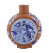 A Chinese Yixing enamelled snuff bottle, 19th century, painted in blue enamels to each side with