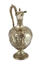 A Victorian embossed silver pyriform hot water ewer, by Martin, Hall & Co, decorated with flowers,