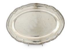 A George III silver oval meat dish, by William Fountain, with gadrooned border and engraved crest,