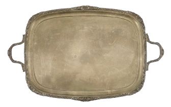 A late Victorian silver two handled rounded rectangular tea tray, by Goldsmiths & Silversmiths Co.