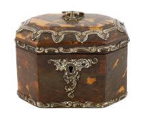 A Victorian silver mounted blond tortoiseshell tea caddy of octagonal form with loop handle and