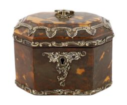 A Victorian silver mounted blond tortoiseshell tea caddy of octagonal form with loop handle and