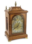 An Edwardian marquetry inlaid mahogany eight day chiming bracket clock in architectural case with