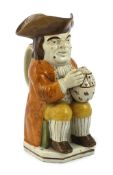 A Staffordshire Prattware Toby jug, c.1790-1800, seated in standard pose holding a frothing beer