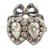 A 19th century gold, silver and diamond cluster set twin hearts ring, with ribbon bow surmounted,