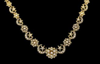 A late Victorian gold and seed pearl set necklace, lacking drop, with crescent and foliate cluster
