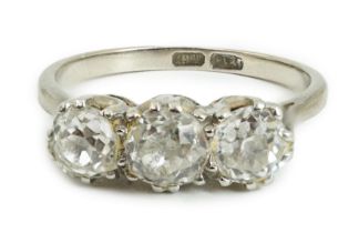 An 18ct white gold, platinum and three stone diamond set ring, the central stone diameter