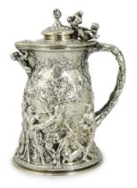 ROYAL INTEREST: A good ornate Victorian Teniers style silver ewer with hinged cover by Frederick