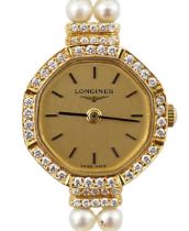 A lady's modern 18k and diamond chip set Longines quartz octagonal wrist watch, on a twin strand