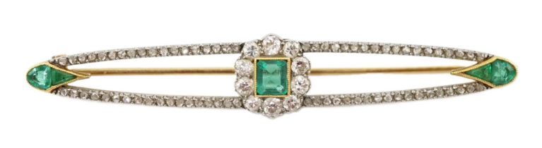 A Belle Epoque gold and platinum, emerald and round cut diamond cluster set elliptical bar brooch,