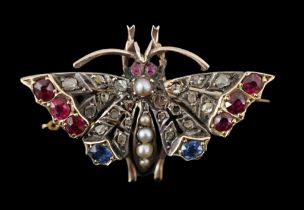 A Victorian gold, ruby, sapphire, split pearl and diamond cluster set butterfly brooch, with