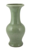A Chinese carved celadon glazed yen-yen vase, 19th century, decorated with bamboo and other foliage,
