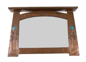 In the manner of Archibald Knox, a Scottish Arts & Crafts planished copper overmantel, with shelf