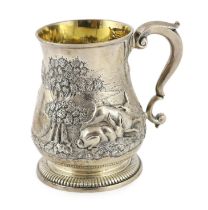 A George II silver baluster mug, by David Willaume II, later decorated with continuous countryside