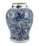 A Chinese blue and white 'Phoenix' baluster vase, Kangxi period, painted with phoenixes amid dense