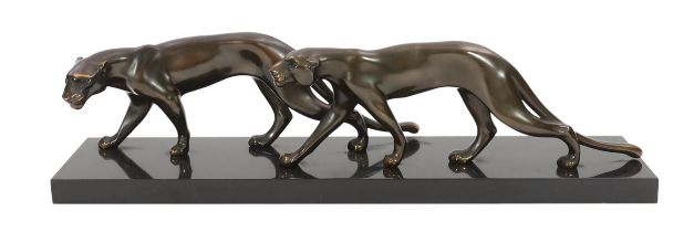 Marty Font, a French Art Deco bronzed and black marble group of two prowling panthers, signed on the
