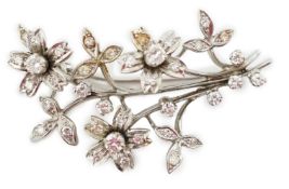 A 1960's 18ct white gold and diamond cluster set floral spray brooch, 41mm, gross weight 9.9