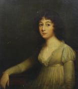 Late 18th century English School Half length portrait of a young lady, seated with her arm resting