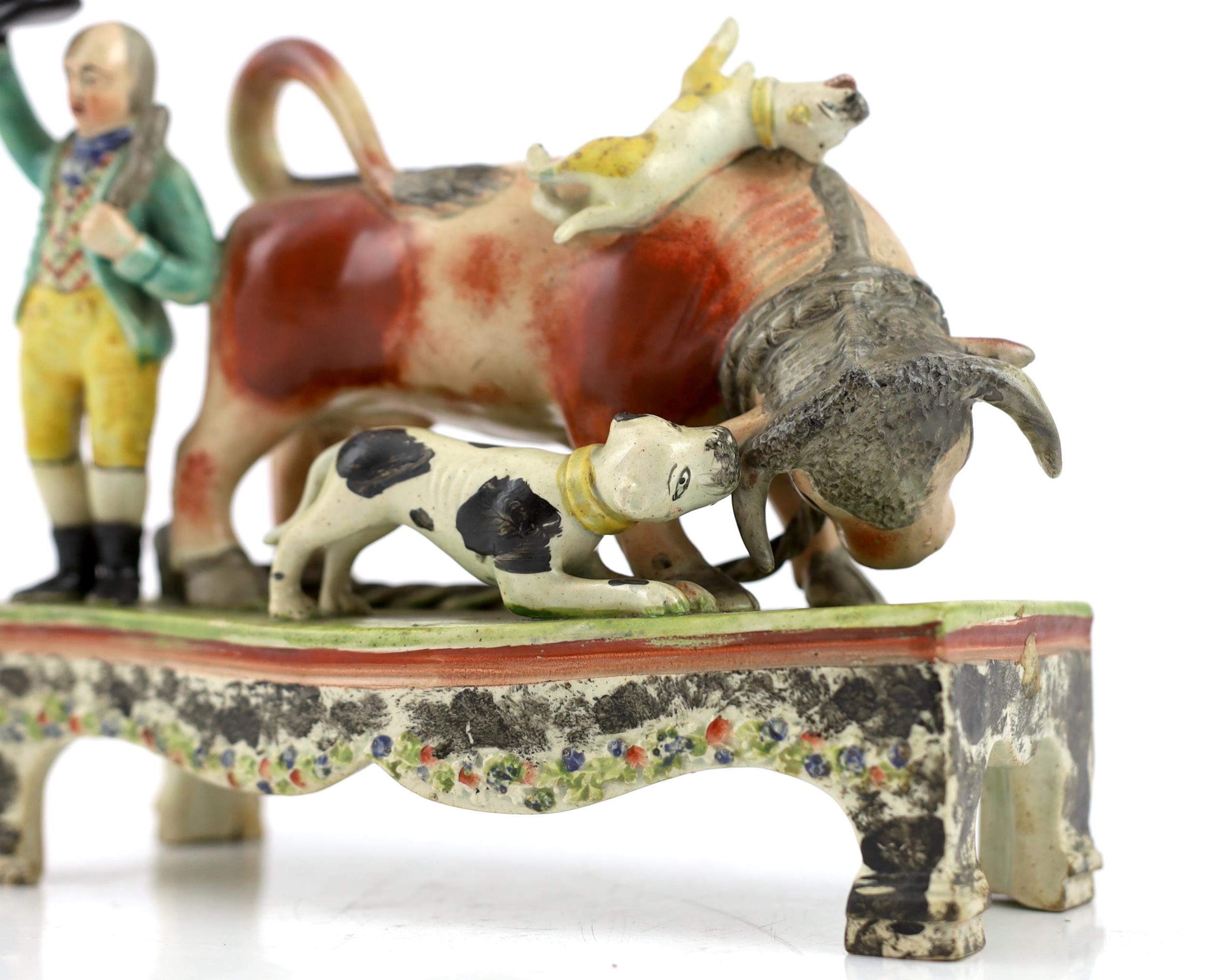 A Staffordshire pearlware bull baiting group, of Obadiah Sherratt type, c.1830, the figure of a - Image 3 of 6