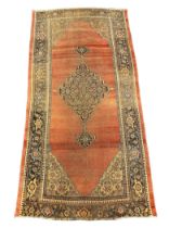 An antique Bidjar carpet with central medallion on a russet ground, multi bordered, 365 x 185cm***