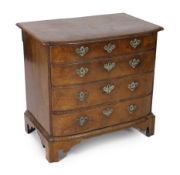 An 18th century Dutch walnut bowfront chest, with moulded top and four graduated long drawers, on