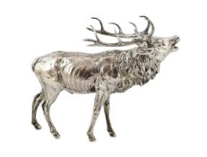 An Edwardian Hanau silver free-standing model of a baying stag, the detachable head with engraved