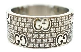 A modern Italian Gucci 18ct white gold and diamond chip cluster set couture band, with pierced