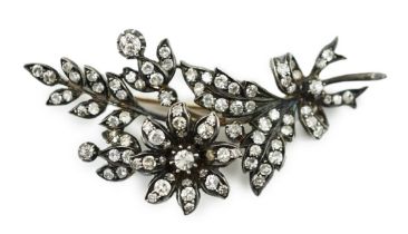 A late Victorian gold, silver and diamond cluster set trembleuse floral spray brooch, 58mm, gross