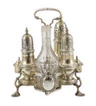 A George II silver cruet stand, with three matching graduated casters, by Samuel Wood, with ring