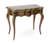 A late 19th century French ormolu mounted marquetry card table with serpentine folding top opening