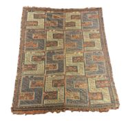 An antique Caucasian geometric rug, with divided field of S motifs 255 x 210cm
