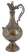 An ornate Victorian silver hot water jug, by Elkington & Co, of bulbous form, with embossed