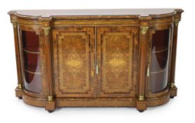 A Victorian marquetry inlaid figured walnut credenza of breakfront form with two panelled doors